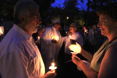 Lighting Candles at Memorial.jpg